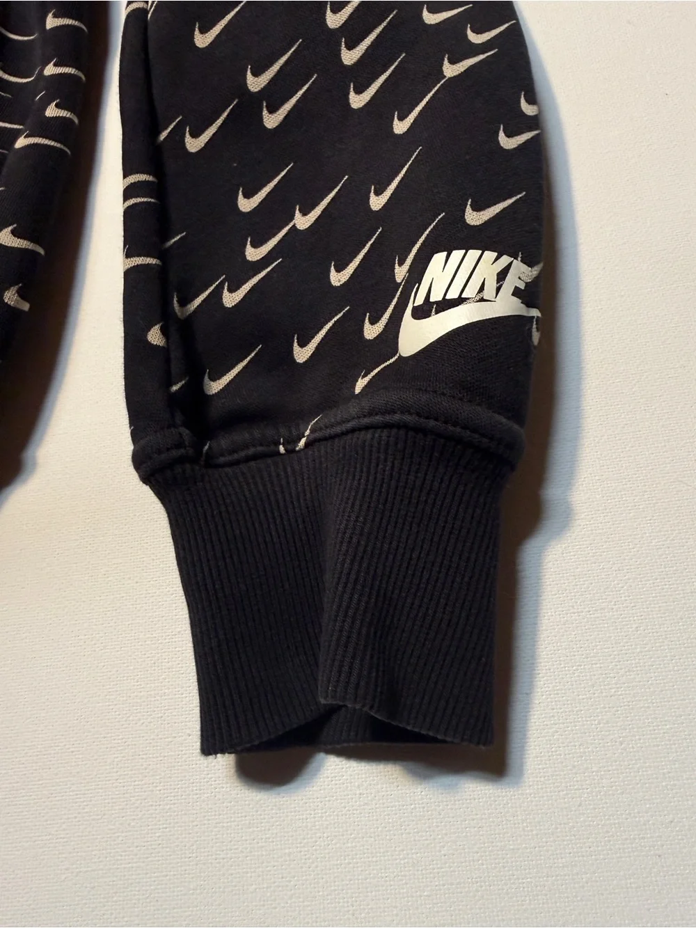 Nike‎ Black Hoodie with Repeating White Swoosh Print